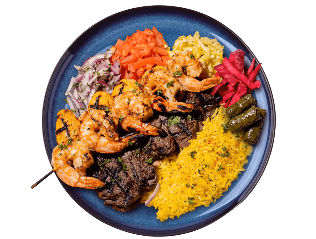 Mediterranean mixed grill platter with shrimp, beef, rice and vegetables